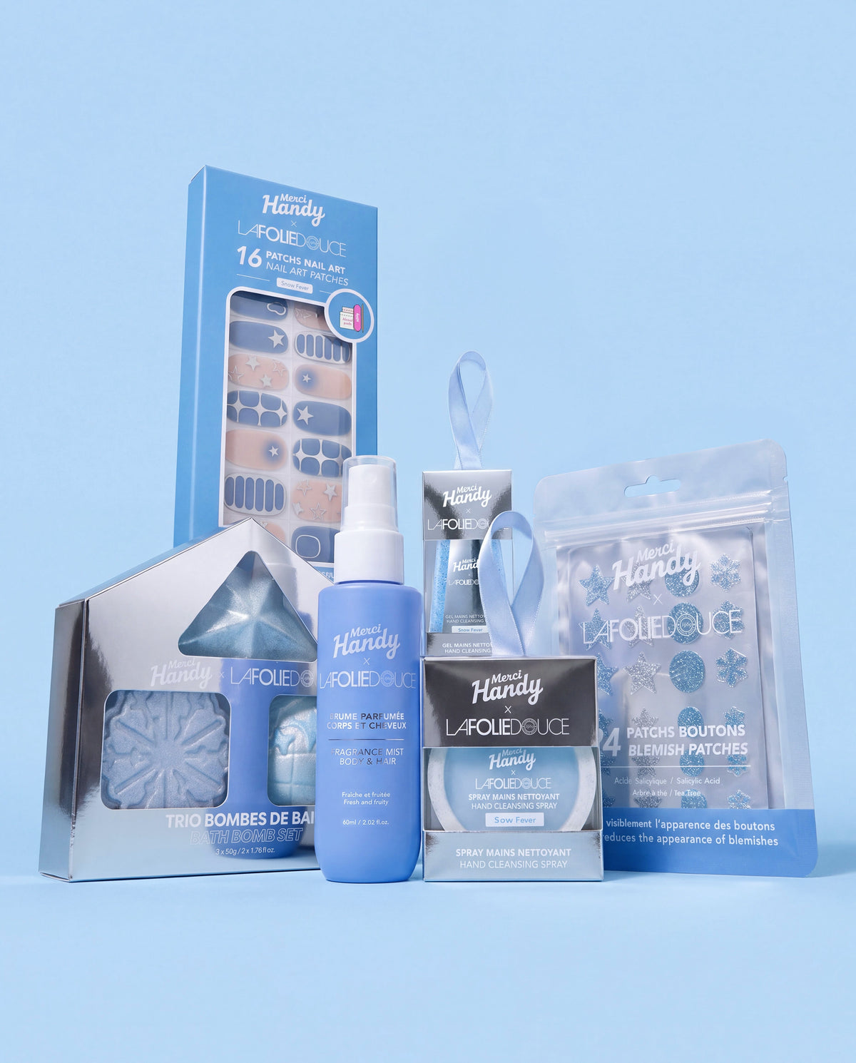Master Pack x La Folie Douce™ Merci Handy – the 6 products of the edition on a blue background