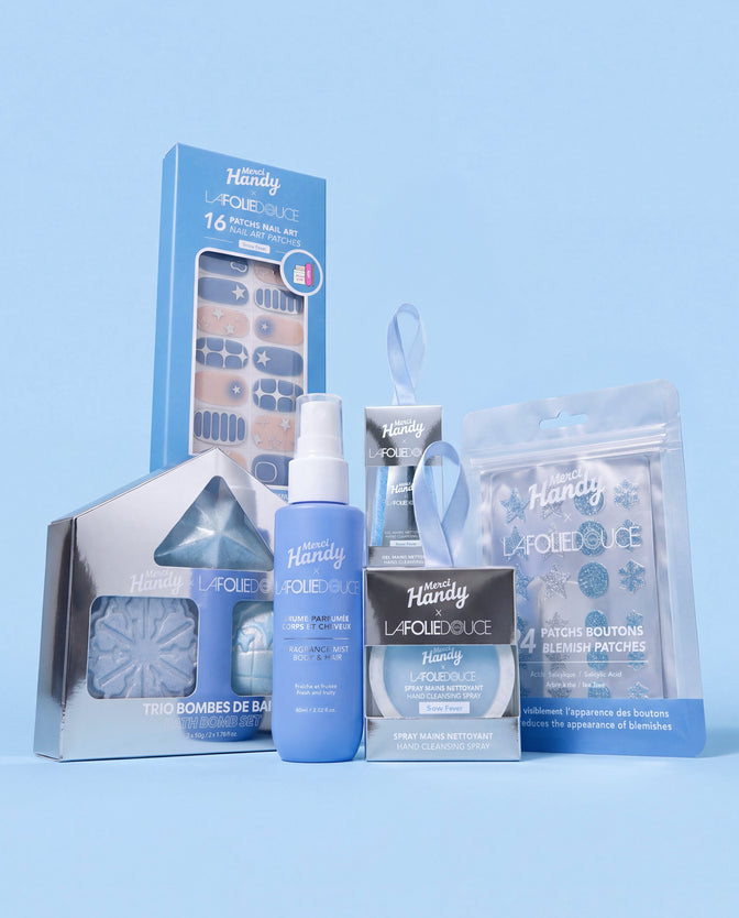 Master Pack x La Folie Douce™ Merci Handy – the 6 products of the edition on a blue background